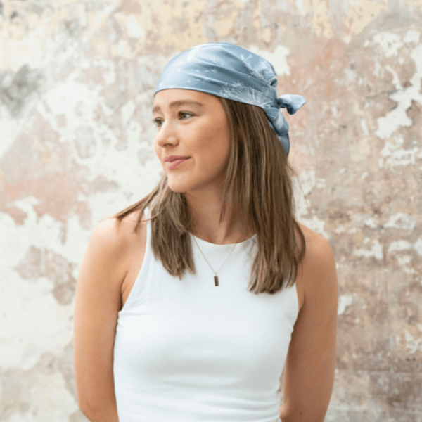 a girl wearing the canteen dandelions bandanna