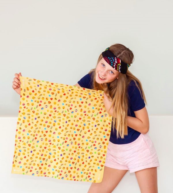 A young person holding the party colourful bandanna