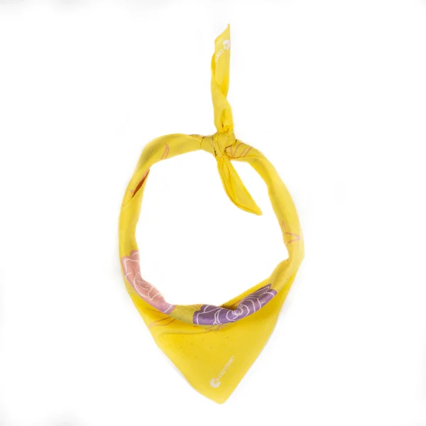 A photo of the Smell the Roses bandanna tied up and styled