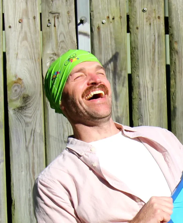 A person wearing a bicycles bandanna on their head