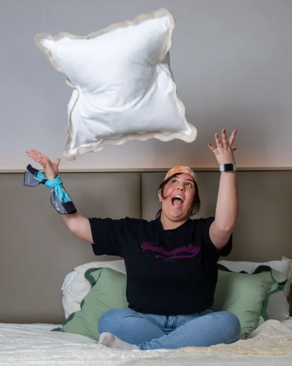 A person wearing a Pillow Talk - Flower bandanna throwing a pollow